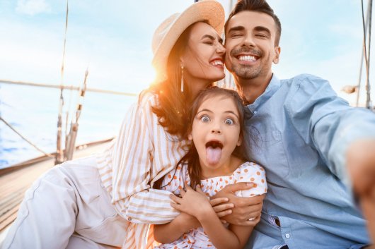 Happy young family resting on yacht &copy; Pixel-Shot - stock.adobe.com